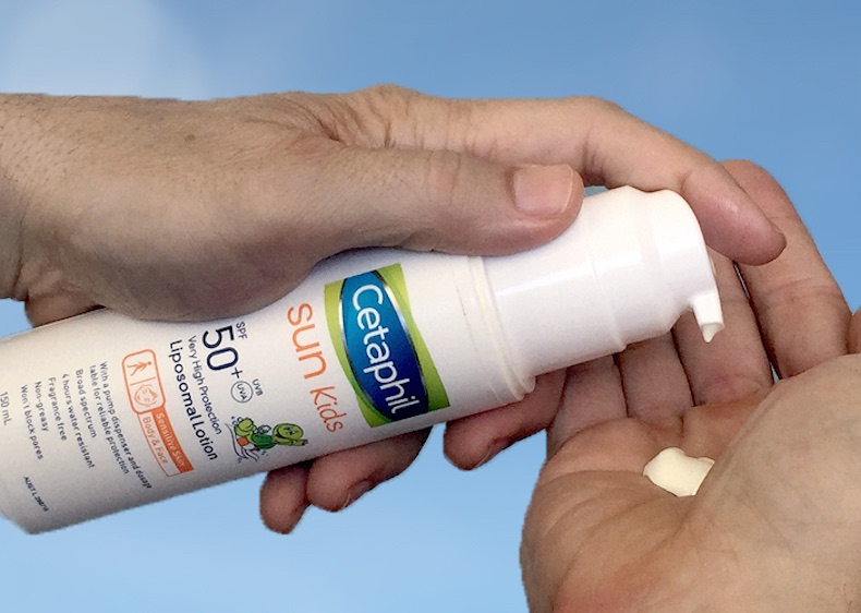 Applying Cetaphil Sun Kids sunscreen to the hand