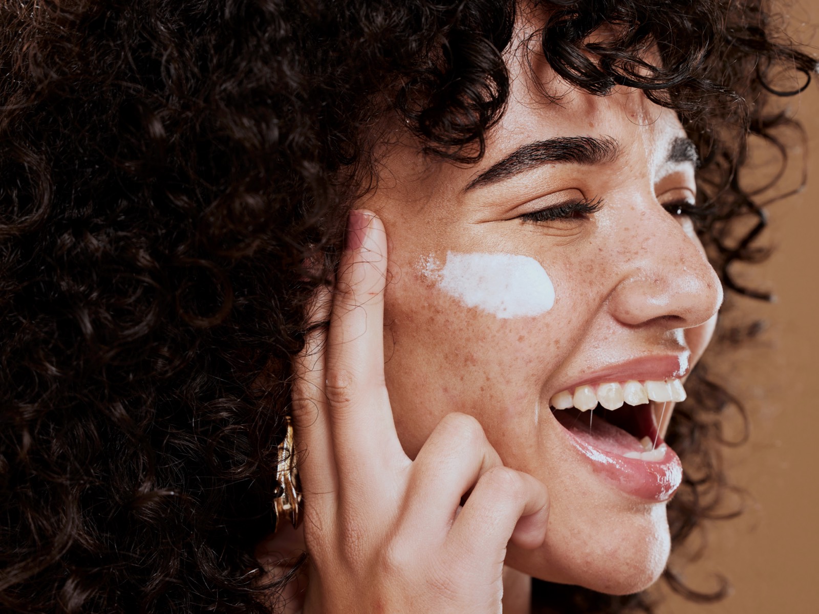 Woman applying a medication for melasma