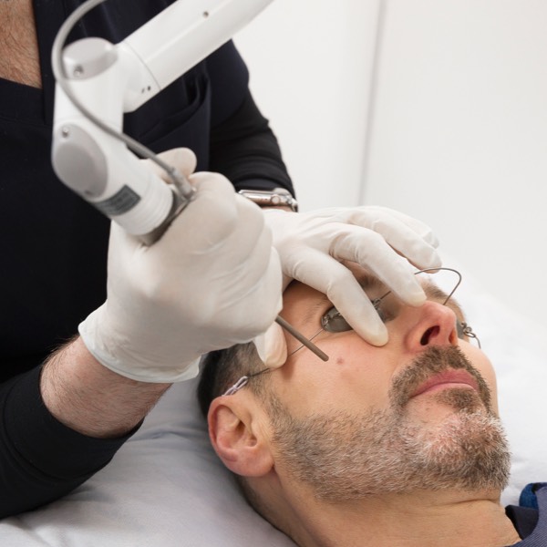 Patient undergoing laser skin treatment