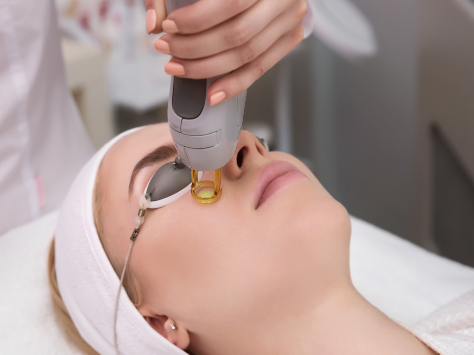 Laser treatment to young woman's face