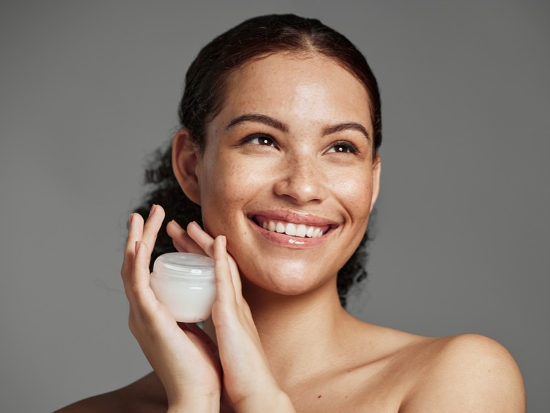 Woman using Topical vitamin B3 (niacinamide)