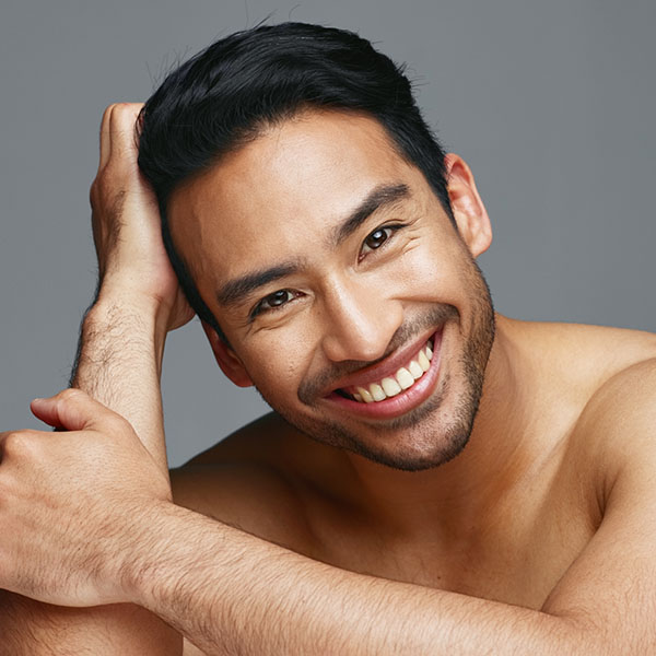 Smiling Asian man - angel brightening laser treatment