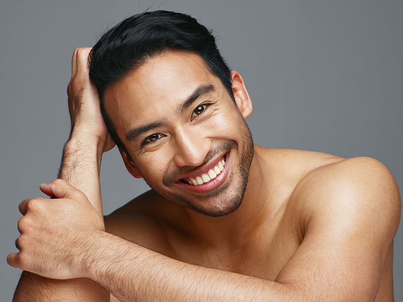 Smiling Asian man - angel brightening laser treatment